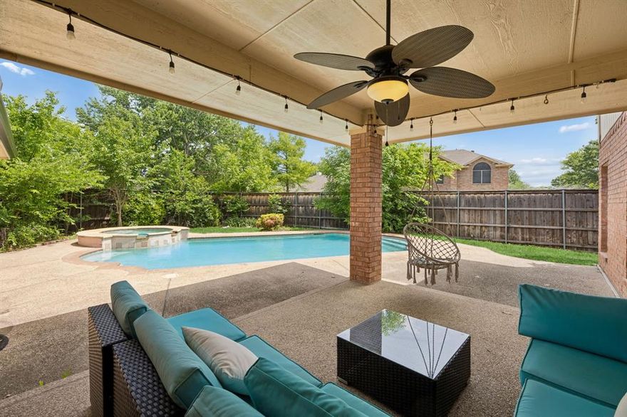 Positioned on a spacious corner lot in an established neighborhood, 3400 Palmtree Drive offers a rare combination of size, upgrades, and outdoor living that today’s buyers actively search for. Built in 1996 and spanning approximately 3,101 square feet, this 5-bedroom, 3.5-bath residence delivers a flexible layout with two bedrooms conveniently located on the main level, ideal for a variety of living arrangements or work-from-home needs. The open-concept design connects the main living areas while maintaining defined spaces for both entertaining and everyday functionality. A well-appointed kitchen with island and walk-in pantry provides ample storage and prep space, complemented by generous cabinetry and natural light. The primary suite features a spacious bath with dual sinks, vanity seating area, and a relaxing jetted tub, creating a comfortable retreat within the home. Step outside to a private backyard oasis designed for year-round enjoyment, complete with a  heated pool with a new pool motor that has a 1-year warranty, a spa, and a covered patio. Mature trees surrounding the property enhance privacy and create a lush, tranquil setting, while a nearby trail just steps away adds to the outdoor appeal. The oversized garage includes a Tesla charger, and the wide driveway allows for additional parking and convenience. Recent improvements include a brand-new Class 3 impact-resistant shingle roof with a transferable warranty, offering both durability and long-term value. Additional updates throughout the home contribute to a move-in-ready experience. Located with convenient access to major commuting routes including Highway 121 and Highway 75, this property combines comfort, location, and lifestyle in one compelling offering. Enjoy proximity to neighborhood green space, scenic walking paths, and a peaceful cul-de-sac setting that enhances everyday living while maintaining strong resale appeal in a sought-after market.