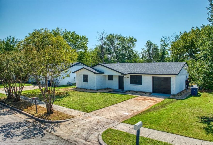 Step into this beautifully updated home filled with character and charm. Freshly painted with new hardware, wood laminate, and tile flooring, every detail has been thoughtfully designed. The kitchen is a standout feature, offering plenty of storage with an island, elegant cabinets, two spacious pantries, and a stylish tile backsplash. Extensive trim work throughout the home adds a touch of sophistication. Move-in ready and brimming with updates, this home is perfect for anyone seeking comfort and style!