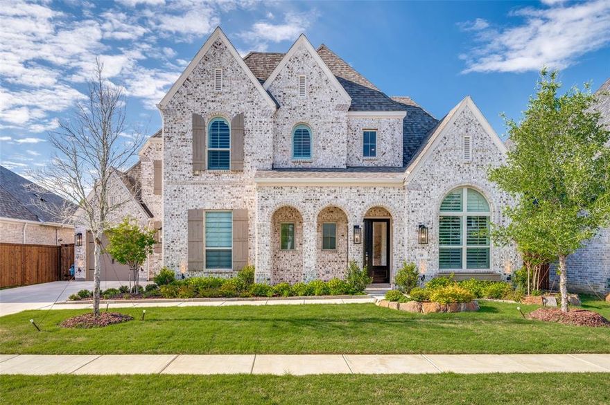Stunning luxury Highland Home in vibrant master-planned community Sandbrock Ranch! Featuring 5 bedrooms, 7 baths, and multiple living areas. Thoughtfully curated upgrades offer a perfect blend of comfort, elegance, and everyday luxury. Spacious three-car garage provides added convenience and storage. Step through a soaring entry and curved staircase into beautifully designed interiors with extensive hardwood flooring, dramatic ceilings, and an open-concept layout filled with natural light. Expansive living area showcases a wall of windows overlooking a private backyard and breathtaking greenbelt views. Sliding glass doors open to a covered patio, creating seamless indoor-outdoor living ideal for relaxing or entertaining. Gourmet kitchen features a large island, 6-burner gas cooktop, quartz countertops, farmhouse sink, double ovens, and walk-in pantry, all open to main living and dining areas. Spacious primary suite offers peaceful greenbelt views and a spa-inspired bath with freestanding soaking tub, oversized frameless glass shower, dual vanities, and a large walk-in closet. Enjoy resort-style amenities in Sandbrock Ranch, including the Carriage House, resort-style pool and splash pad, state-of-the-art fitness center, stocked fishing lakes, fire pit, lakeside patio, miles of hike and bike trails, dog park, recreation fields, and event lawn for community gatherings. Rare opportunity to own a luxury home with exceptional views, privacy, and a premier community lifestyle. Just 15 minutes from PGA Frisco and the upcoming Universal Studios.