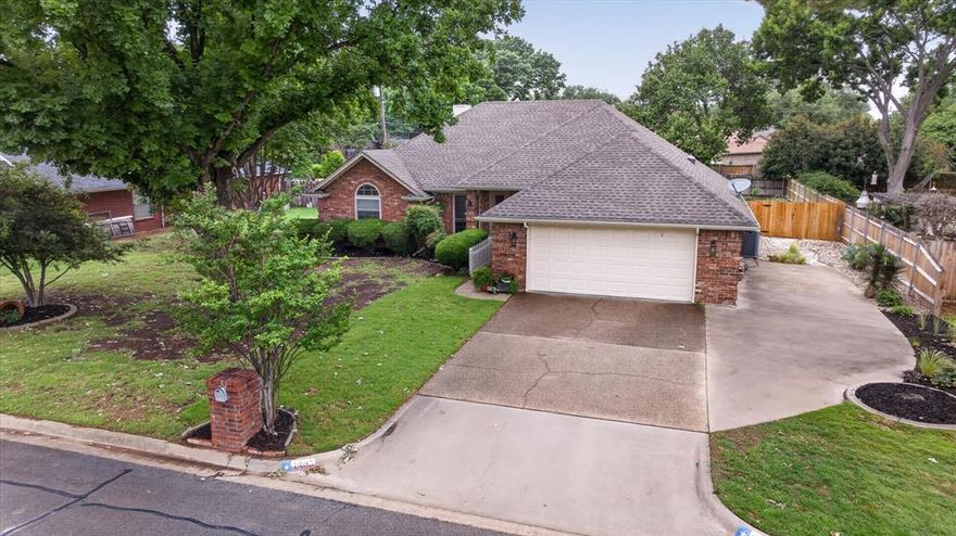 Hard to find in the Southtown area of Granbury.  Come see this 3 bedroom, 2 bath, 2 car garage and half bath in the garage home just minutes from Harbor Lakes Golf course, ride your golf cart to go shopping, dining and close to the the Historic Granbury square.  This home is move in ready.   Has a privacy fence around the beautiful park like back yard.  In the back yard you will find a pergola just outside the screened in back porch, a rocked sitting area, flower beds, shrubs and on the side of home extra drive for a boat or RV.  The home is a split bedroom set up, and has ensuite primary bedroom, bath setup.  The backporch has been closed in to make a 15 x 7 enclosed, screened back porch for sitting and enjoying the morning coffee or evening atmosphere.   Living room has a wood burning fireplace and is sitting in an open concept with small dining room and opens to kitchen with an island and sit down bar area.   Home has window coverings and blinds which convey.   Vaulted ceilings in the living area and some bedrooms make the home have bigger feel.  Seller is willing to sell the refrigerator, washer and dryer.