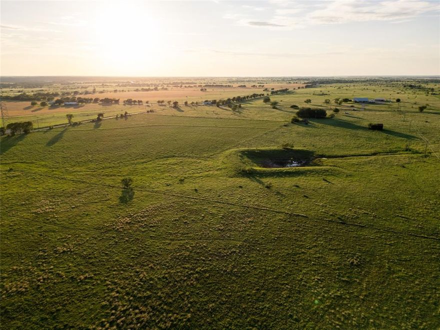 145± Acres – Rare Large Tract in Crawford ISD, McLennan County: Exceptional opportunity to own a 145-acre expanse in a coveted pocket just outside Waco. This tract offers a versatile mix of rolling grazing pastures and cultivated fields, with road frontage on three sides for superior access. Utilities are available at the road, making it easy to plan your ranch estate or development. The land features an existing stock tank (pond) with a strong watershed (needs only minimal work to enhance), supporting livestock and wildlife. Fully fenced and cross-fenced, it’s turnkey ready for cattle rotation – complete with gated sections for easy management. Enjoy peace and privacy in a quiet, secluded setting with no noise pollution, all while being less than 2 minutes from Hwy 6 and a short drive to Waco. Large tracts over 100 acres are rarely available here, and this one comes with an ag exemption in place for low taxes plus income potential from farming or grazing leases. Ideal as a private dream-home ranch, a strategic buy-and-hold investment, or for smart development into smaller parcels. Clean, prime, and prepared – a rare find in this high-demand area that checks all the boxes for land buyers, ranchers, and investors.