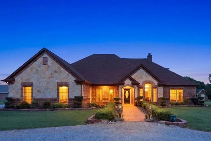 4 bedroom, 2.5 bath home in Justin with a split bedroom layout and well-designed floor plan. The kitchen features granite countertops, gas cooktop and oven, and an eat-in area, with a separate dining room and dedicated office.

Tile flooring runs through the main living areas, with carpet in the bedrooms. The living room includes a wood-burning fireplace. Granite countertops continue in the bathrooms, with tiled showers throughout.

The primary suite offers separate sinks, jetted tub, separate shower, and a large walk-in closet.


Exterior features include 2.5 acres, trees, and room for a pool  all in a fenced yard with gated entry, covered patio and separate pergola, and a 2-car garage. Property is on well water with a whole-house water softener. No HOA.

Located in Justin within Northwest ISD, with convenient access to Fort Worth, approximately 25–35 minutes to DFW International Airport and about 45–60 minutes to Dallas.

Well maintained and move-in ready.
