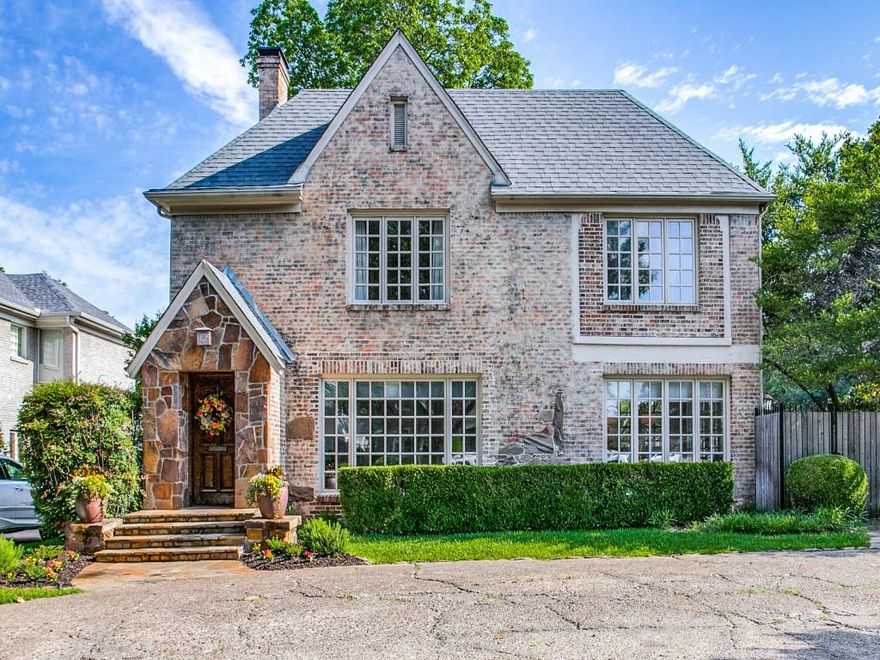 Handsome brick home on wide corner lot in coveted UP location close to Snider Plaza, pool, parks and schools. With light-filled rooms, updated baths, 2 laundries, abundant storage and plenty of parking, this home is ready for a crowd. The gracious living room with stone fireplace leads to a sunroom overlooking the stone patio and fountain. The large dining room has a handy storage closet. The kitchen with granite and SS appliances opens to the family room. A downstairs bedroom with ensuite bath makes the perfect guestroom. The utility room and powder bath complete the downstairs. Upstairs, the spacious primary suite with decorative fireplace, large sitting room and updated bath is a private retreat. A guest bedroom with ensuite bath and another bedroom with adjoining bath are up. A sunny playroom or upstairs office, a second utility and a cedar closet are also upstairs. A 2-story bookcase lines the stairwell. A 2 car garage and wide circle drive in the front provide plenty of parking.