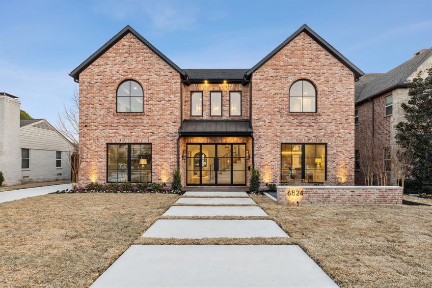 Set on a premier 70x150 lot in the heart of Lakewood, this timeless new build by Gramercy Custom Homes leaves no detail overlooked. The stately antique brick exterior and striking entry set the tone for this incredible home. Inside, experience arched openings, museum finish walls, thoughtful interiors, and hand selected finishes that collectively create a warmth and charm rarely found in a new build. In the kitchen, a remarkable 10ft Calacatta Gold marble island and hand-crafted Moroccan tiles pair beautifully with the top-tier appliances including a built-in Miele coffee system. Impressive arched steel doors open to an expansive outdoor living area overlooking the sparkling pool-spa, fire bowl seating area, and plenty of yard for play. Upstairs the secluded primary retreat welcomes with a soothing color palette, spa-like bath with coffee bar, and dreamy custom closet. A short stroll to Lakewood Elementary and White Rock Lake, this has everything you could want in a sophisticated home.