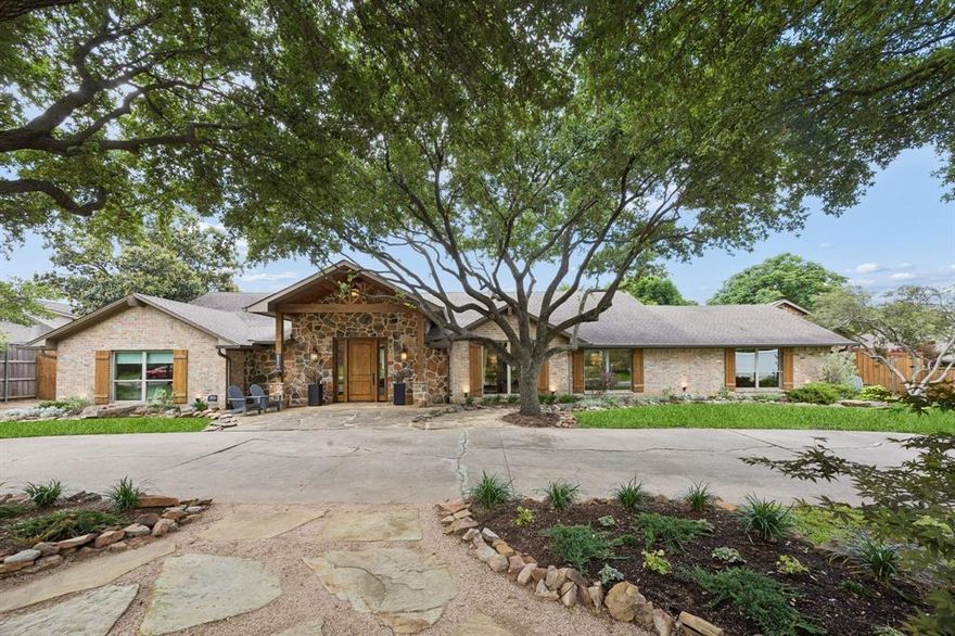 Experience refined comfort and exceptional living in this beautifully updated Northwood Hills Estates residence, ideally situated on a sprawling .44-acre lot in one of North Dallas’ most established and sought-after neighborhoods. Surrounded by mature trees and featuring a circle driveway, this impressive 4-bedroom, 3.5-bath home offers a rare combination of architectural charm, spacious design, and resort-style outdoor living.
Inside, vaulted ceilings, abundant natural light, and stunning reclaimed wood floors create a warm and inviting atmosphere throughout the main living areas, kitchen, dining room, and primary suite. The expansive layout offers exceptional versatility, featuring three spacious living areas, including a main living room with a striking stone fireplace and expansive views of the backyard patio and pool.
At the heart of the home, the chef’s kitchen showcases a massive leathered granite island, walk-in pantry, ample cabinetry, and seamless flow into the dining and living spaces. A dedicated media room with a dry bar provides the perfect setting for movie nights, game days, or entertaining guests, while a private office offers ideal work-from-home flexibility. A huge walk-in laundry room adds convenience and functionality.
The well-designed floor plan includes a private guest bedroom with its own ensuite bath, while two secondary bedrooms share a convenient Jack-and-Jill bathroom. The luxurious primary retreat is a true sanctuary, complete with a cozy fireplace, spa-inspired ensuite bath with dual sinks, soaking tub, oversized walk-in closet, and a versatile bonus room ideal for a nursery, gym, or additional office space.
Outdoor living is equally impressive, featuring a gated heated pool and spa, expansive deck, covered patio with fireplace, generous green space perfect for relaxing or entertaining year-round, and the added convenience of an oversized garage with ample room for storage, hobbies, or additional parking.