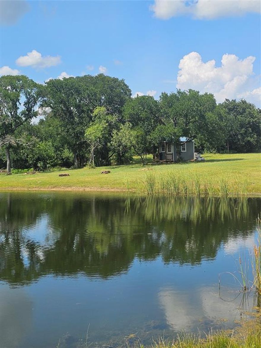 Charming 19-Acre Retreat with Pond, Wildlife & Workshop Escape to your own private 19-acre paradise featuring a serene, fish-filled pond—perfect for peaceful afternoons, outdoor entertaining, or gathering around a fire under the stars. Nestled in pristine, wooded surroundings, this well-maintained 1-bedroom cabin offers a quiet retreat and has been lightly used, still feeling like new. The property is rich with wildlife, including deer, dove, and small game, making it an ideal haven for nature lovers, outdoor enthusiasts, or hunters. Winding trails throughout the acreage invite exploration while maintaining a sense of privacy and tranquility. A standout feature is the impressive 1,880-sq-ft shop, complete with electricity and water and a dedicated workshop area—perfect for hobbies, equipment storage, or future projects. Whether you’re seeking a weekend getaway, hunting retreat, or peaceful homestead, this unique property offers endless possibilities and room to breathe.