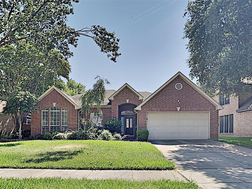 WONDERFUL HOME IN THE HIGHLY SOUGHT AFTER WELLINGTON ADDITION! NEWER CARPET! UPDATED FIXTURES AND FANS!  Neutral tones. 2-inch blinds. Split bedroom floor plan. A plethora of windows giving the home a light and bright feel. Vaulted ceilings! Bay windows! Main family room includes a brick wood burning fireplace that opens to the breakfast nook and kitchen. STAINLESS APPLIANCES!!! Breakfast bar, an island, breakfast nook, stylish subway tile backsplash and an abundance of cabinet and counter space are a PLUS! 4TH bedroom perfect for a study! Oversized primary suite features dual vanities, a garden tub, separate shower and HUGE walk-in closet. Large private fenced yard. Check it out!