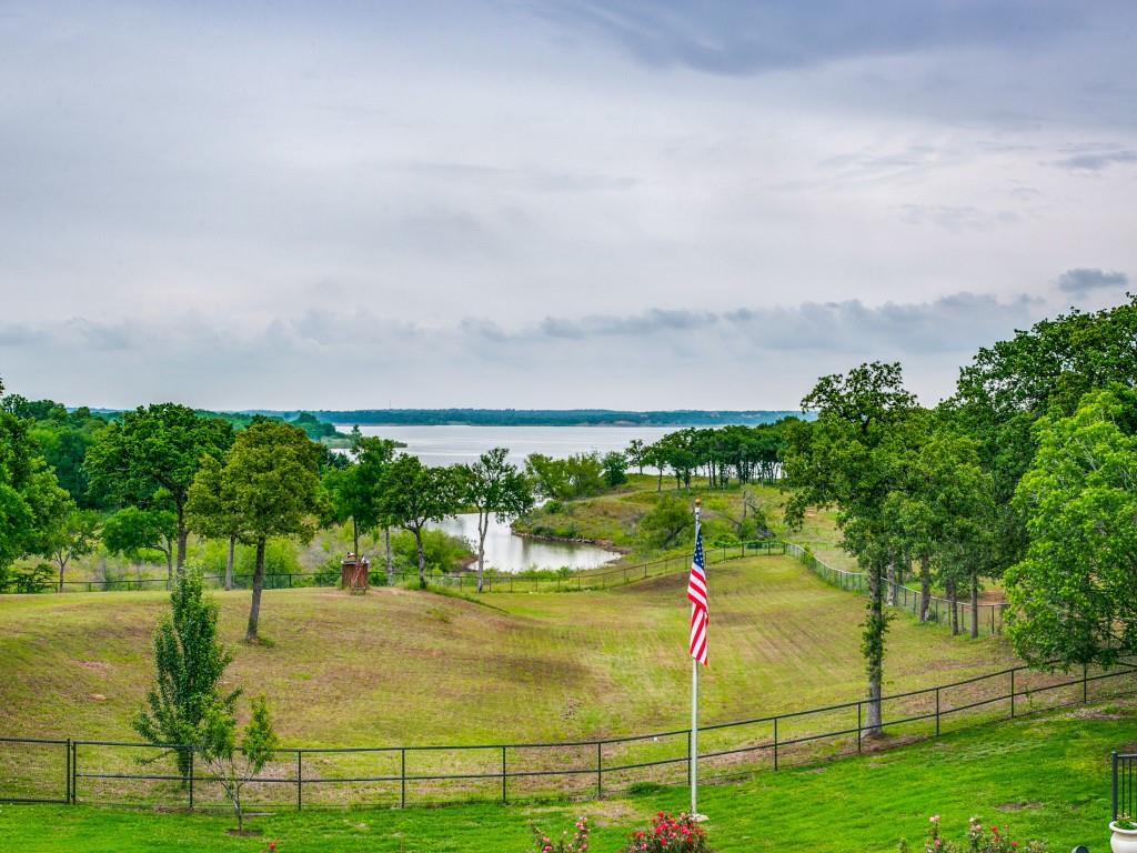 HOME FOR THE HORSES. This Beautiful Custom Home in Cul-De-Sac w 4 Stall Horse Barn w additional Entertaining Room & up to 10K Bottle Temperature Controlled Wine Room on Over 3 Acres w View of Lake Grapevine. Home backs Corp of Engineer Property & has Access to the Lake. Home Features a Large Screened Deck & Open Air Deck w Stairs to the Gorgeous Pool & Spa w Waterfall & in water Table w Seating. Huge Outdoor Kitchen w Green Egg, Built in Grill & more. Main House has Brick and Wood Floors, Light & Bright Open Floor Plan w Incredible View of the Lake from nearly Every Room. Gourmet Kitchen w Granite Counters, Thermador 6 Burner + Griddle Gas Range, Built in Refrigerator, Miele Built in Coffee Maker & Dual Sinks. Exercise Room & Huge Game Room Upstairs. Two Wells on Property which run Sprinkler System. Bring your Horses for the Quite Country Living in the Heart of Southlake. CARROLL ISD.