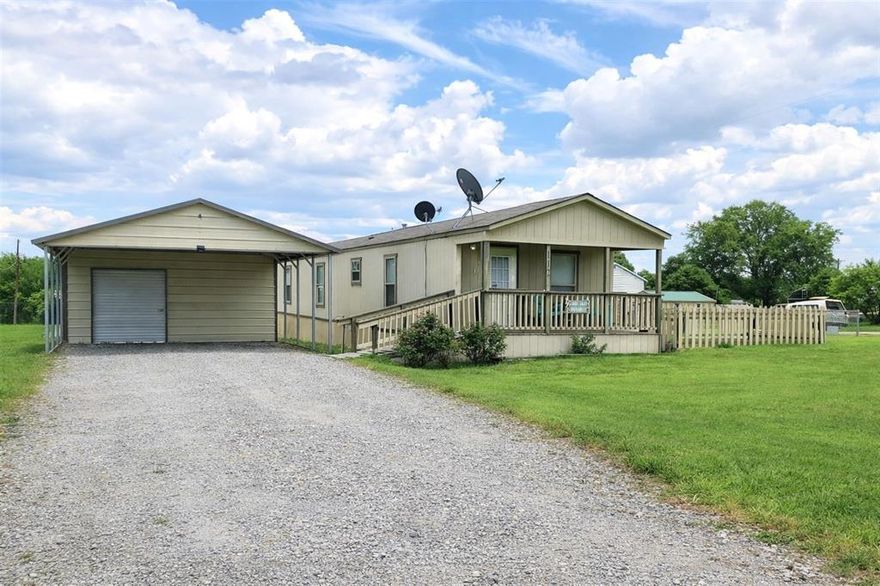 Your fishing retreat awaits at Lake Fork! This charming 2-bedroom, 2.5-bath single-wide modular home sits on a spacious 100x100 corner lot in the gated waterfront community of Holiday Village. Thoughtfully updated with new vinyl plank flooring, smart siding, and handicap-accessible ramps on both the covered front porch and back deck, this home also features a large fenced yard with doggie door, storm shelter, carport with storage room, and negotiable furnishings. This property is ideal for full-time living, a weekend getaway, or an income-producing investment. Holiday Village offers fantastic amenities including fishing piers, boat ramps, a clubhouse with table games, swimming pool, playgrounds, basketball court, picnic areas, and a variety of community activities like potlucks, bingo, chair yoga, and more. HOA dues are $52 per month and the well-water filtration and sewer services at $65 each plus usage. High-speed internet is available, you can bring your golf cart, ATV, boat, and fishing pole and start enjoying lake life today!
