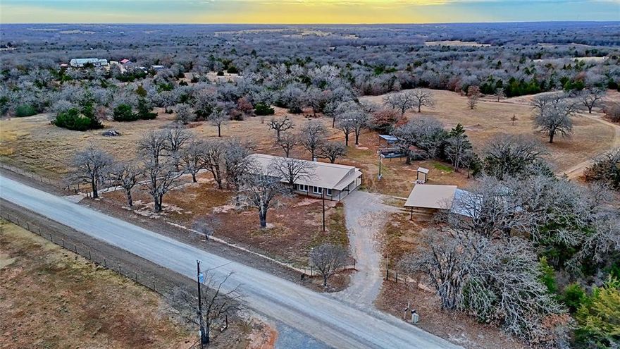 Are you looking for COUNTRY life!!! You have found this single level 3bed 2bath, completely fenced REMODELED and UPDATED home waiting for you on 12.47 ACRES........Updates include kitchen with GRANITE counter tops, custom cabinets, SS appliances including PROPANE convection RANGE, microwave, dishwasher, refrigerator conveys too, WOOD block ISLAND and large WALK IN pantry.......almost all windows have been updated.......Master bath has updated SOAKING TUB, WALK in SHOWER, and COPPER double sink vanity......CUSTOM MASTER closet.......Master bedroom has it's own exit door......added INSULATION..........most FLOORING updated..........hot water heater and HVAC updated....fencing is hog wire and barb wire.........15 x 40 insulated SHOP with concrete floors and electricity......25 x 40 4 car CARPORT........WELL house is insulated with filtration........WOOD burning stove to heat the entire house.........EXTRA LARGE LAUNDRY room with washer and dryer.......CHICKEN COOP........FIRE PIT.......almost entire perimeter of the house has a COVERED patio......2 DRIVE THRU gates at the front of the home..........SHED........several covered areas for tractors and ranch animals.......dam the raven and you could even have a tank too..........so much more!!!!