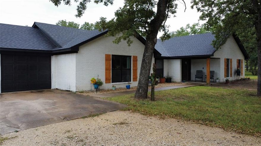 This charming country-style brick home offers a welcoming retreat-style experience, featuring substantial outdoor space with 3 acres and thoughtful amenities like a workshop, pool, gazebo, and mature oaks.  The home is move-in ready with upgraded outdoor features like roof, windows, and a new irrigation system.  Don't miss out on this country retreat!