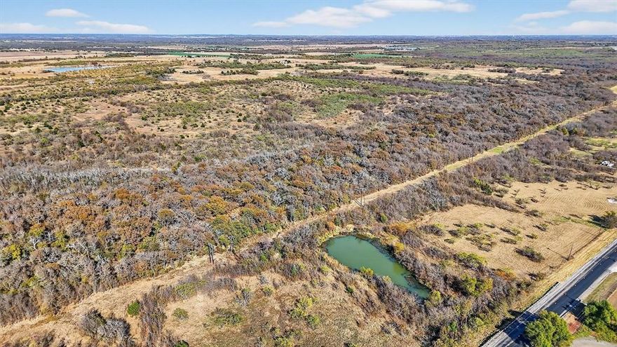 Outstanding 195.55-acre property offers a rare opportunity to own a large, prime tract of land with substantial potential upside. With frontage on both Highway 56 and Deaver Road, the property is perfectly positioned to take advantage of the area’s growth. The future tollway path nearby will only add to the land’s value, making it a prime opportunity to hold for long-term appreciation. The varied terrain with a mix of trees and open pasture includes two ponds and provides a unique landscape with endless possibilities. Agricultural exemption in place. This property is extremely well positioned to benefit from the present and future growth of north Texas and the Sherman area. Survey in additional documents on MLS.