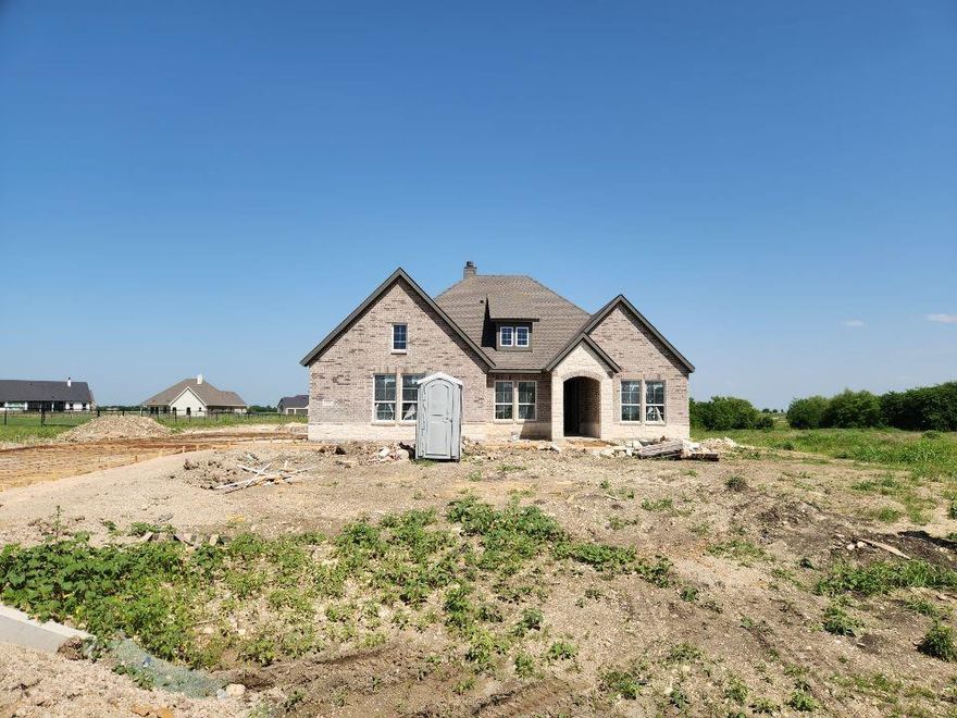 Estimated June 2026 completion! Ask us about our Trade In Trade Up program, we can buy your home! The Verbena floor plan features a modern, open-concept layout and the sought-after features today’s homeowners are searching for. With four bedrooms, three bathrooms, and a flex room, this plan boasts just over 2,400 square feet of functional living space. Upon entering the home off the front porch, you’re welcomed by an inviting foyer. Immediately to the left is a hallway with a bedroom, walk-in closet and full bathroom, as well as a linen closet. Across the foyer is a flex room, perfect for a home office, formal dining room or whatever need your family has for the space. Past the foyer is the family entry, with storage space and mud bench, which leads to the laundry room and two or three car attached garage. Through the entrance, the home opens up to a large family room with a stately fireplace. Adjacent to the family room is a gourmet kitchen, equipped with a walk-in pantry, ample counter space and an oversized island. Finishing off this open-concept living area is a dining space which overlooks the covered back patio. The remainder of this one-story floor plan is just off the living space. A hall leads to two bedrooms with walk-in closets, another linen closet and a shared full bathroom. The back corner of the home offers privacy for the owner’s suite, featuring a massive walk-in closet and bathroom with a dual-sink vanity, standalone soaking tub and glass-enclosed shower.