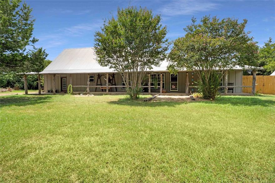 Escape to your own private 5-acre paradise! This hidden gem sits far back from the road, wrapped in complete privacy with fencing and cross-fencing, a separate backyard, and even a dedicated dog run. Towering trees frame the property, while the lush back pasture is perfect for horses, livestock, or simply wide-open space to roam. The versatile barn offers a front area for animals, a rear storage section, plus a wood shop with its own bathroom and office—ideal for hobbies, projects, or business. Three additional sheds add even more storage potential.
A storybook front porch sets the tone, leading into a bright, open layout. The show-stopping spiral staircase sweeps up to a spacious loft, while the gorgeous kitchen steals the spotlight with abundant cabinetry, a central island, and a built-in planning station.
The serene primary suite feels like a retreat, featuring a spa-like ensuite, huge walk-in closet, and convenient access to the utility room. Generously sized secondary bedrooms and a massive second living area make the perfect game room, media space, or play zone. The home is upgraded with a 95 gallon heat pump water heater.
This property delivers the best of both worlds—peaceful country living with thoughtful upgrades and endless possibilities for animals, entertaining, and everyday enjoyment!