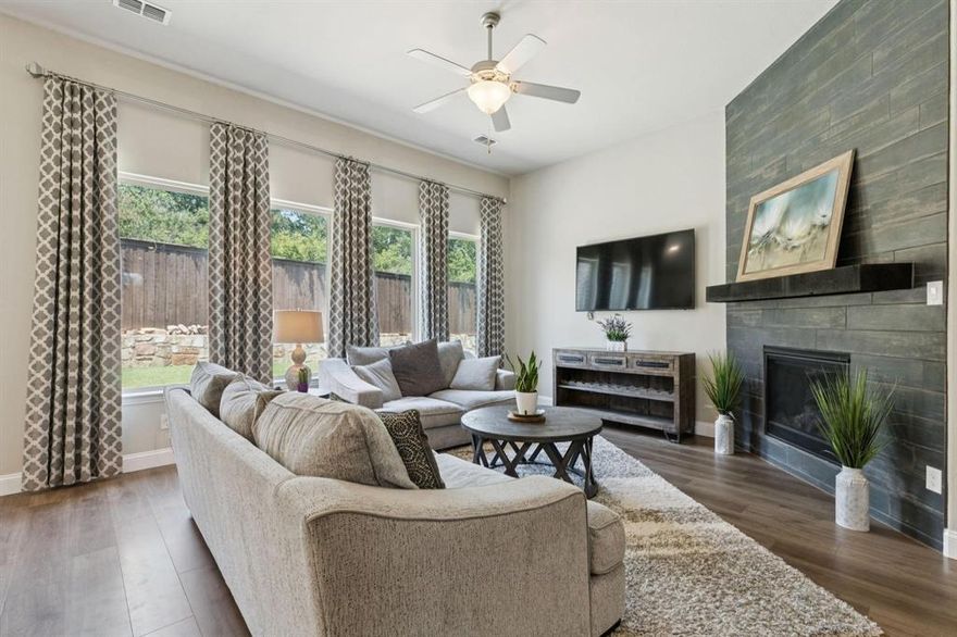 5 Bedrooms, 4 Baths + Game Room + Office + Flex space! Looking for a spacious 5-bedroom home in Corinth zoned to Guyer High School with room for everyone? This beautifully designed 3,522-square-foot home in Denton ISD offers the perfect blend of functionality, flexibility, and modern style in a quiet neighborhood near shopping, dining, and major commuter routes. With four bedrooms and three full bathrooms downstairs, the layout is ideal for multigenerational living or busy family mornings. The open-concept floor plan centers around a stunning oversized kitchen island with elegant finishes, abundant cabinetry, and generous prep space—perfect for weeknight dinners, homework sessions, and weekend gatherings. Natural light pours through the home, highlighting soaring tray ceilings and creating an airy, welcoming feel. A dedicated home office with modern sliding barn doors makes remote work both productive and private. Need flexible space? A downstairs flex area near two bedrooms and a full bath works beautifully as a kids’ retreat, guest suite, or in-law setup. Upstairs, a striking wood and wrought-iron staircase leads to a private retreat featuring a spacious game room, fifth bedroom, and full bath—ideal for teens, long-term guests, or extended family. Outside, enjoy a peaceful backyard on a .20-acre lot with a large patio perfect for relaxing evenings or entertaining friends. Located in Denton ISD and zoned to highly rated John H. Guyer High School, this home combines space, comfort, and premium upgrades you won’t find in a standard builder package. If you’ve been searching for a move-in ready home in Corinth with a smart layout and room to grow — this one checks all the boxes.