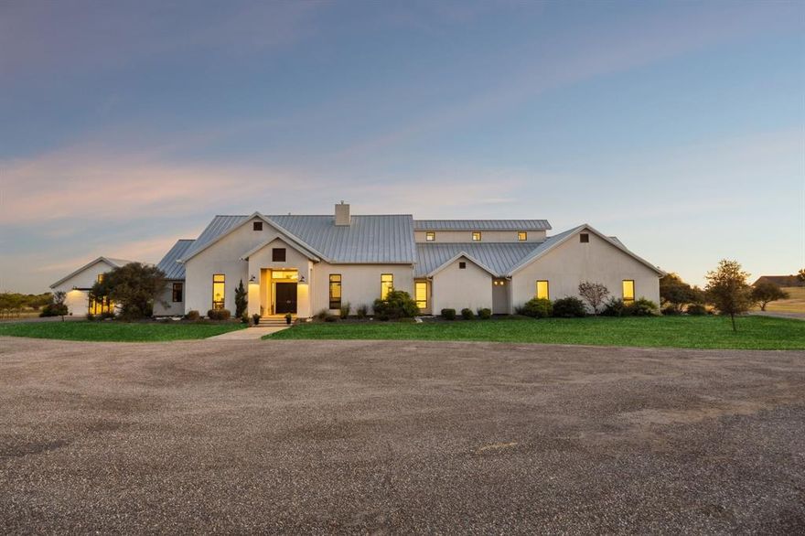 You’ll love the privacy, the space, and the freedom this modern country estate delivers. Tucked back off the road on over 6 acres with no HOA, you can live wide-open here, yet still remain close to everyday conveniences, schools, dining, and major routes.

Inside, you’ll enjoy a residence designed for elevated living and effortless hosting. The kitchen features dual oversized islands, built in appliances, gas cooktop, double dishwashers, double microwaves, and walk in pantry. The main level library wrapped in custom hickory built ins offers a true retreat, while multiple living areas, two private offices, and a bonus room upstairs create flexibility for the way you live daily.

Step outside and the property transforms into a destination. The custom  built diving pool, with 11ft depth and salt cell replaced in 2022. The detached Barn Event Structure is climate controlled with two half baths and kitchenette ready for celebrations, indoor recreation, studio, creative space, or future customization to suit your lifestyle or vision.

With a deep private well supplying water, a buried 1,000 gallon owned propane tank,  sprinkler system, and septic system—major systems are already set up for ease and efficiency. Whether you envision acreage living that feels resort like, a home that invites connection and entertaining, or a property with flexibility to evolve over time, this is where you’ll finally have the room to make that happen.