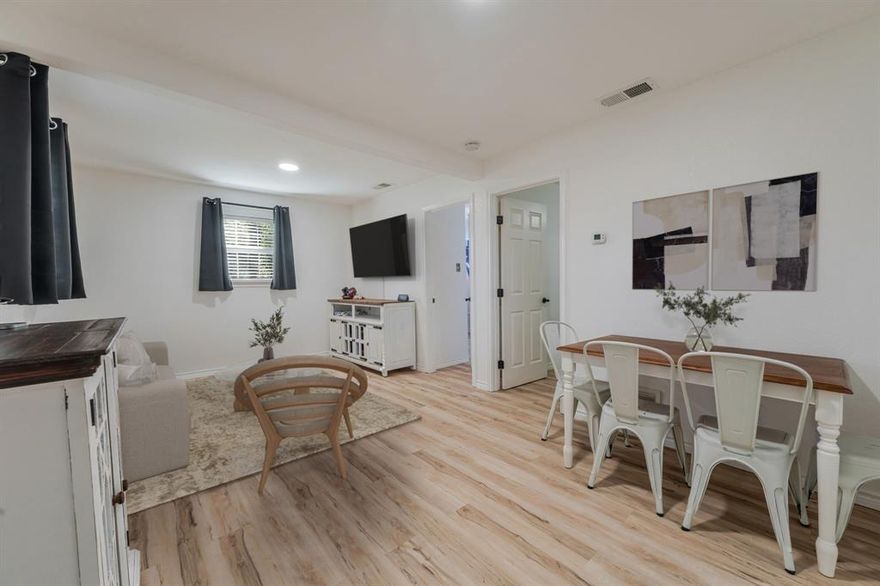 This cozy cottage blends farmhouse warmth with fresh modern updates. Inside, new appliances, sleek countertops, and luxury vinyl flooring pair perfectly with crisp, freshly painted walls for an easy, move-in-ready feel. Relax on the inviting front porch deck—ideal for slow mornings, sunset chats, or hosting friends. Nestled in a peaceful, tree-lined setting with a detached garage, this home delivers the perfect balance of rustic charm and modern convenience.