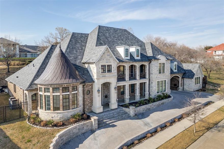 Breathtaking Estate crafted by highly acclaimed Lewis & Earley Custom Homes, completed in 2022 (4 yrs old) and located in prestigious guard-gated Enchanted Hill. This exquisite residence is a masterpiece of thoughtful design and uncompromising luxury, spanning nearly 7,000 sq ft and perfectly balanced for seamless everyday living and grand-scale entertaining.  The home boasts five exceptional bedroom suites—including two primary suites (both downstairs for ultimate convenience) and a dedicated guest suite on the main level, plus two additional suites upstairs—paired with 6.5 baths, a dedicated study, game room, theatre room, expansive 4-car garage, and abundant premium living spaces. No detail overlooked, with architectural elegance and high-end upgrades throughout. The show-stopping chef's kitchen is a culinary dream: premium quartzite countertops, professional Wolf Range (6 burners, grill, pizza option), Sub-Zero refrigerator seamlessly matching the gorgeous custom cabinetry, Asko dishwasher, dual copper sinks, and tailored custom drawers to fit any need. A massive central island pairs with a second social island—ideal for gatherings.  The primary suite is a true luxury retreat, featuring a spa-worthy bath with Bain Ultra hydro-thermo massage tub with air jet system, enormous walk-in shower with Mr. Steam functionality, and an oversized closet rivaling any boutique.  A well-appointed home office near the front entrance complements a versatile second office or flex space with a clever hidden door behind a bookcase, adding even more intrigue to the home. Upstairs, the theatre room flows to an adjacent wet bar (room for full-size fridge) serving the game room, plus a 200+ sq ft balcony with stunning views.  Expansive sliding doors from the family room open to a large, private backyard primed for any gathering.  This rare gem blends timeless craftsmanship, modern sophistication, and resort-like amenities. Don't miss your chance—schedule your private tour today!