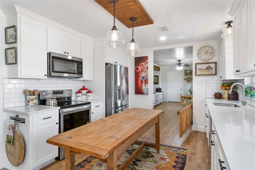 Don’t miss this beautifully renovated 3-bedroom, 2-bathroom charming country retreat that sits on nearly 2 serene acres with over $160K in improvements. Recent upgrades include a freshly painted interior, Rheem tankless water heater (2023), Ecobee smart thermostat, LED lighting, and Halo air purification system. The kitchen includes stainless Whirlpool appliances with an infrared cooktop. The 2022 HVAC system and new ProFlo aerobic septic system add modern convenience. Additional upgrades include a red galvanized steel roof (2020), grooved siding with battens, and brick skirting around the foundation. This is a rare opportunity to own a move-in ready home that blends rustic charm with modern comforts in a quiet, star-filled country setting. This lovely home features large, well-groomed trees, a gently sloping yard, and a seasonal creek that flows most of the year. A generous laundry room offers excellent storage. Located on a quiet road with only three homes, it offers privacy, peace, and a true sense of rural Texas living—just minutes from town. Inside, the home features spacious open-concept living areas with cedar-wrapped beams, recessed lighting, and stylish finishes. Enjoy a large, covered front porch with an energy-efficient ceiling fan—perfect for outdoor dining. The backyard features a stock tank pool, flower beds, and a spacious deck for entertaining. The hogwire-fenced dog run provides a safe play area for pets. A 3-bay carport includes a large storage closet and custom cabinets. The property also offers a 20' shipping container and a beautiful deluxe fully insulated private retreat measuring 12x16, heat and air, electricity and double-pane windows.