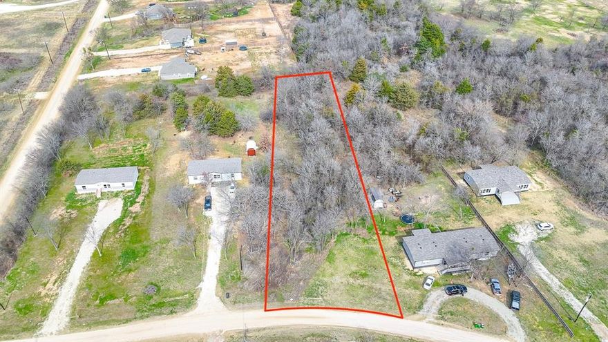 One-acre lot in Mildred ISD, just minutes from Richland Chambers Lake. This heavily treed property offers a private, natural setting with plenty of space to clear while still preserving mature trees. Mobile homes are allowed, giving you flexible options for a full-time residence or weekend retreat. A water meter is already installed on the property, adding convenience as you plan your build or move. Enjoy a peaceful location with easy access to the lake and nearby amenities.