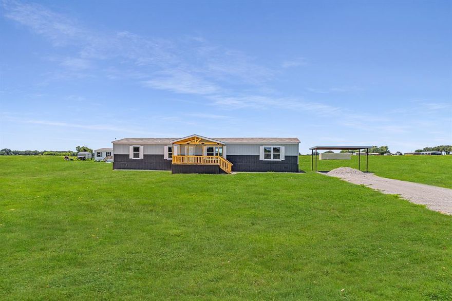 Welcome to your dream home — a beautiful new manufactured home nestled on over 2 acres. This spacious home features an open floor plan, perfect for entertaining guests, accommodating large furniture, or simply enjoying a cozy evening in. The well-appointed kitchen offers a large island, tons of cabinet space, refrigerator, dishwasher, range, and a vented hood — everything you need for effortless cooking and gathering. Retreat to generously sized bedrooms that provide plenty of personal space. The primary suite boasts an en-suite bathroom and an oversized walk-in closet for ultimate comfort and convenience. Additional highlights include recessed lighting throughout, adding a modern touch and bright ambiance to every room.
Step outside to enjoy beautiful outdoor features: attractive wainscoting, a 10x18 covered front deck for relaxing mornings, an 8x8 back deck for evening unwinding, a 20x20 carport, a private well and private septic system. A one-year manufacturer’s warranty is included, giving you peace of mind as you settle into your new home. Don’t miss this opportunity to own your own slice of country paradise with all the modern comforts you desire!

FHA, VA, USDA, and Conventional loans are all welcome!

All information is deemed reliable, and the buyer and buyer’s agent are responsible for verifying all information, including but not limited to the status of construction of the home, lot dimensions, easements, school district, and subdivision restrictions. It is the responsibility of the buyer(s) and the buyer(s) agent to verify the status of completion prior to scheduling site inspections. Please note some photos may have AI generated lawn.