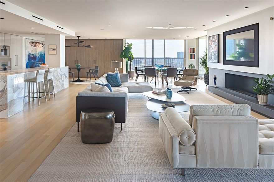 Park Towers, thoughtfully reimagined. This 2,836-square-foot residence pairs clean architectural lines with sweeping city views from a wraparound terrace.

The interiors unfold with quiet confidence—Fleetwood sliding doors, white oak floors, and a honed black limestone fireplace imported from Italy anchor the space. The result is both tailored and effortless, equally suited for intimate evenings or larger-scale entertaining.

The kitchen is a study in precision, featuring a Poggenpohl design outfitted with Gaggenau appliances—where form and performance are equally considered.

Technology is fully integrated yet unobtrusive, with a Savant home system, Lutron lighting, automated shades, and whole-home audio creating a seamless living experience. Even the details are elevated, with Bocci outlets and a custom Porro glass cabinet and wall installation adding a subtle layer of design intention throughout.

The primary suite is composed and restorative, featuring heated floors, integrated shower audio, and chromotherapy lighting.

Custom elements continue throughout, including Poliform closets and Dornbracht fixtures —bringing a level of precision and restraint that defines the residence from start to finish.
