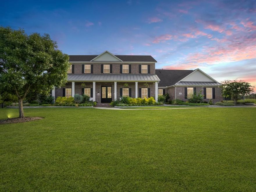 Step into luxury and the epitome of countryside living - stunning ranch-style estate with over 5 acres in Prosper's Whispering Farms. A charming brick facade invites you into a world of refined living - 5 bedrooms with en suites, 3 living areas, 4-car garage and a 3 stall barn. Inside, discover spacious rooms with lofty ceilings and an abundance of natural light. Chef's kitchen with top-of-the-line appliances - Wolf gas range with grilling plate, double ovens, SubZero fridge, and an adjoining hearth room. Oversized private master with spa-like bath and huge walk in closet. His & hers offices with built-ins as well as laundry room heaven with 2 sets of stackable washers & dryers. Also comes with a whole home generator. Your backyard oasis beckons with a heated pool-spa, outdoor kitchen, expansive covered & open living space, plus a fireplace. Neighborhood has walking & golf cart paths and is moments from Gentle Creek Golf Club, Town Lake and The Equestrian Center at Whispering Farms.