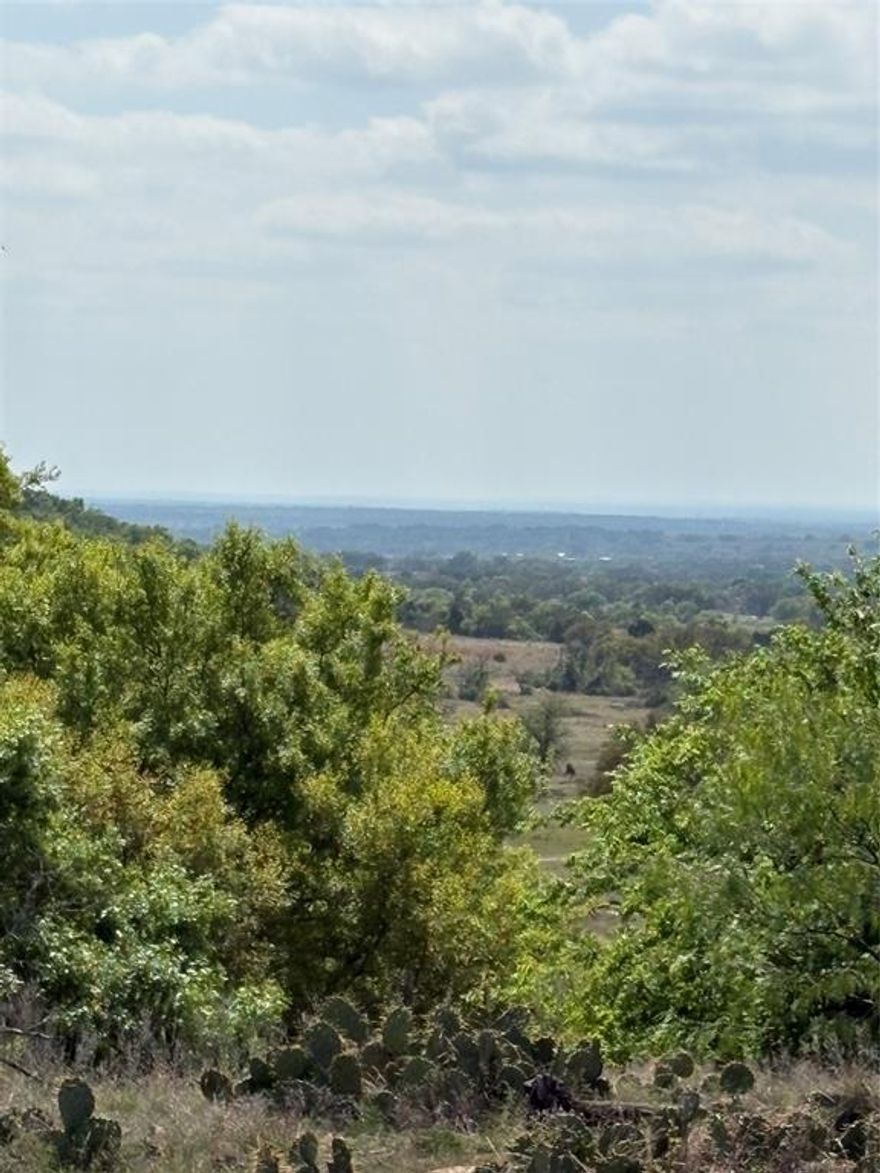 The Mountain Place, a 240-acre combination ranch that has been in the same family since 1927. 

Located north of Goldthwaite, this one-of-a-kind ranch is rich in heritage and natural beauty. You will find mature oak trees, native grasses, open areas, abundant wildlife, and endless character. The topography consists of rolling terrain creating depth and dimension throughout the property, with draws that enhance both the landscape and wildlife habitat. The ranch is well-suited for ranching, recreation, or creating your own private retreat. Ranch improvements include low-perimeter fence, two water wells, stock tank, a water storage tank, and an old wood barn full of character. Enjoy wide-open skies and scenic views of the hill country in every direction. While wind turbines are located nearby, none are situated on the property itself.

The 1,600-square-foot farmhouse with three bedrooms and two bathrooms, blends comfort with rustic charm. Inside, you will find vinyl and tile flooring, ceiling fans, central heat and air and a cozy wood-burning stove. The home sits beneath shady trees and features a welcoming yard complete with a fountain. Outside you will find fruit trees, space for a garden, and even a chicken coop perfect for those seeking a self-sustaining lifestyle. An RV hookup adds convenience for guests or extended stays.  The home is serviced by one of the water wells, a septic system, propane tank, electric through Hamilton County Electric and high-speed Internet from Central Texas Telecommunications. There are utility easements and a gas line through the property. Seller has a current survey, property is ag exempt with livestock onsite, and Seller will convey all owned minerals. Access to the ranch is through adjacent ranch.
 
This ranch is conveniently located approximately 2 hours from Austin and Dallas Fort Worth area. This area of Central Texas is ideal to enjoy nearby attractions such as Colorado Bend State Park, Fiesta Winery, and Lake Brownwood.