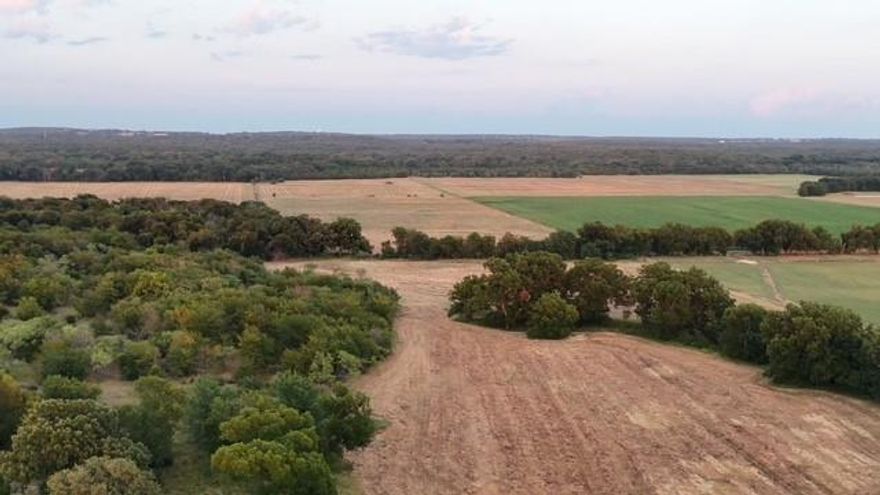 38-55 acre Country Paradise is minutes from Lake Ray Roberts, minutes to the Texas - Oklahoma border, and just an hour north of Dallas - Ft Worth! Looking for the perfect blend of a peaceful country living or investment potential?  This incredible 38 acre tract - carved out of a larger 55 acre parcel, offers you the option to purchase 38 to 55 acres, giving you the flexibility to create your dream retreat or expand your investment.  This land backs up to the Lake Ray Roberts Corp Of Engineers, placing you right at natures doorstep.  Wildlife is abundant, and Lake Ray Roberts is just a short drive away, so outdoor recreation is always within reach.  Whether you're envisioning a custom home, a weekend get away, or a smart land investment, this property is a rare opportunity.  Enjoy wide open spaces, peaceful surroundings, and breathtaking sunsets.  With plenty of room for farming, livestock, or simply soaking in the natural beauty, the possibilities are truly endless.