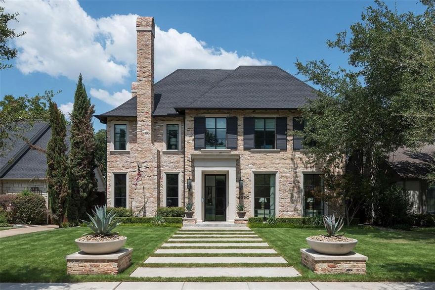 This exceptional custom home, meticulously built by Robert Elliott in 2018, is a masterpiece of modern luxury and an inviting family retreat. Featuring six bedrooms, including a spacious first-floor suite, the design offers sophistication, versatility, and comfort. The light-filled entryway is flanked by a lacquered study with a fireplace and expansive floor-to-ceiling windows, creating an inviting ambiance for work or relaxation. The heart of the home is the family room, featuring a fireplace that opens to the well-appointed kitchen with gourmet appliances catering to culinary enthusiasts. The adjacent formal dining room includes a beautiful wine cellar, setting the stage for memorable gatherings. Throughout the first floor, floor-to-ceiling steel windows not only flood the living spaces with natural light but also provide a harmonious blend of interior and exterior entertaining. The second floor features four ensuite bedrooms and an expansive playroom with a full bath, with the potential to convert it into an additional bedroom. The third floor boasts a sixth bedroom and full bath, could be utilized as a workout room. Every detail has been thoughtfully curated with exquisite wallpapers and designer finishes. The interplay of aesthetics and functionality is further exemplified by the covered patio, complete with retractable screens and an outdoor kitchen. The outdoor living space extends into a meticulously turfed and landscaped backyard with a putting green, creating an oasis of relaxation and enjoyment.