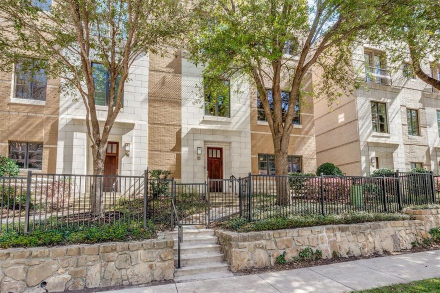 Exceptional three-story corner residence in the heart of Uptown offering the perfect blend of style, space, and outdoor living. This 3-bedroom, 3.5-bath home features amazing natural light throughout. Guests will love the beautiful stone path leading to your front door. The ground level includes a two-story foyer, a dedicated home office, and a generous bedroom with ensuite bath. You’ll enter the home through your RARE three-car garage — hard to find in Uptown. The garage offers ultimate flexibility for extra storage or even a home gym. The second level features a large living area, half bath, pantry, kitchen, and dining room. The elegant kitchen includes a wall of new cabinetry, copper apron sink, new quartz countertops, new pendant lighting, stainless appliances, and a new wine fridge. Warm hardwood flooring connects the spaces and highlights the new custom built-ins. An enormous dining room can handle a crowd with ease, while the living room expands outdoors to a private balcony with a cozy fireplace — the perfect place to start or end your day. The third level features a spacious primary suite with spa-style bath, oversized glass shower, dual vanities, and a generous walk-in closet with built-ins. All bathrooms have been updated with new quartz surfaces for a fresh, modern feel. The primary bedroom floats above the treetops and offers a large seating area next to a Juliet balcony. Two people working from home? No worries — there is a second office adjacent to the primary bedroom sitting area. The sky is the limit on the expansive rooftop deck, complete with pergola, water connections, and turf grass — perfect for entertaining, relaxing, or enjoying the Dallas skyline. Your new home also includes a private elevator to effortlessly transport you, your luggage, your Costco order, and all your Amazon finds. Residents enjoy access to the sparkling community pool, all just steps from the Katy Trail, West Village, dining, shopping, and nightlife.