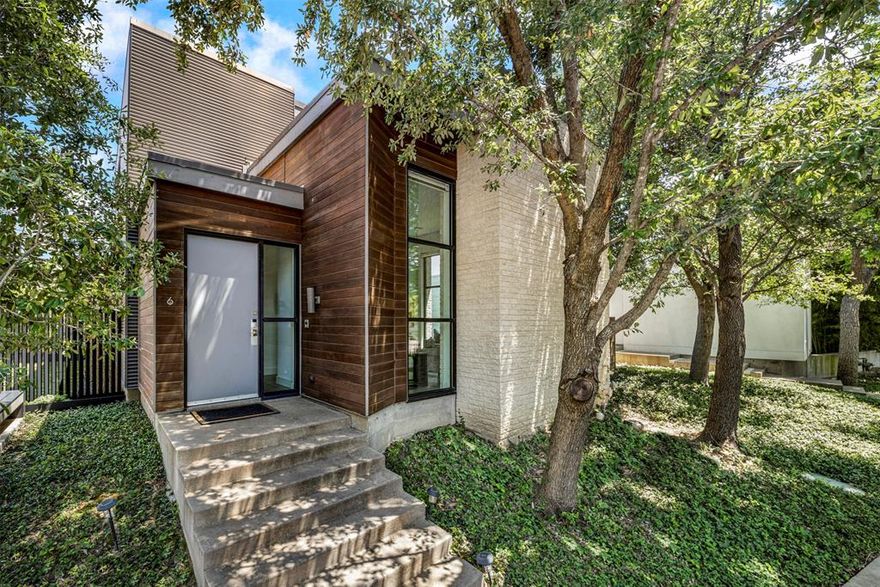 Executive retreat meets modern sophistication in this architecturally acclaimed residence designed by award-winning Bernbaum & Magadini Architects, located within the highly celebrated Urban Reserve community in Dallas. This distinctive design-forward home features 3 bedrooms, 2 baths, a media room, offering both flexibility and refined modern living. Ideally situated just steps from White Rock Creek Trail and only minutes from NorthPark Center and Royal Oaks Country Club, this home combines exceptional design with premier convenience. Upon entering, you are welcomed by Lutron dimmable lighting throughout, soaring 14-foot ceilings, expansive, high-efficiency floor-to-ceiling windows, custom Lutron Electronic Shades and an open-concept contemporary layout filled with abundant natural light. Thoughtfully curated architectural details include bamboo staircases and hallways, polished concrete floors, and a striking crushed glass fireplace anchoring the main living area. The chef-inspired kitchen is designed for both everyday living and entertaining, featuring Carrera marble countertops, high-end appliances, and a built-in Miele espresso machine. The media room provides the perfect space for relaxation, movie nights, or entertaining guests. The luxurious primary suite serves as a private retreat with a customized closet system and a spa-inspired ensuite bathroom complete with dual sinks and a spacious dual walk-in shower designed for ultimate relaxation. Step outside to a large backyard ready for a custom pool and lush landscaping, creating endless possibilities for outdoor living and entertaining. Located in the highly sought-after Richardson ISD, this exceptional modern residence offers the perfect blend of architectural significance, sophisticated finishes, and contemporary comfort within one of Dallas’ most celebrated modern communities.