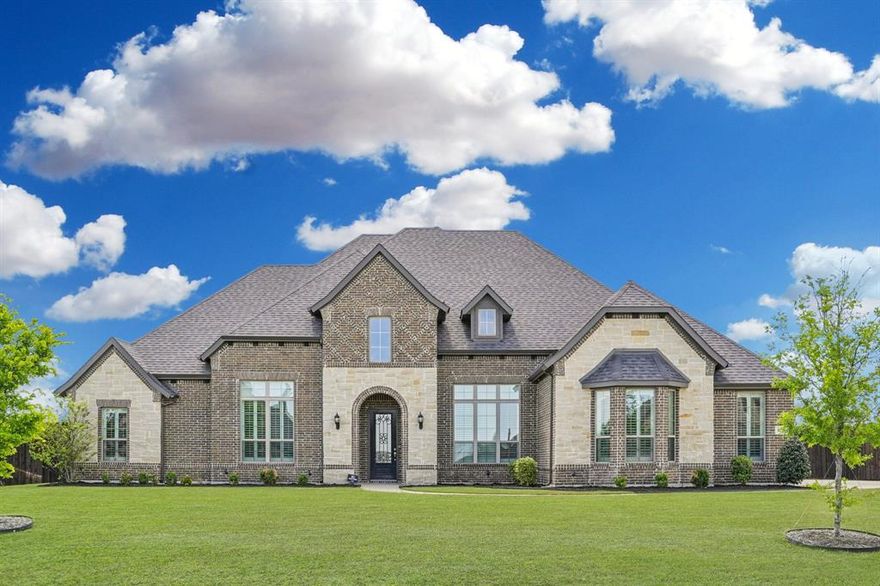 This stunning modern home offers 3803 SF of thoughtfully designed living space set on a spacious one-acre lot. Located in a highly sought-after, well-established neighborhood and in the highly acclaimed Midlothian ISD.  A 3-car garage provides ample parking and storage space.  The expansive family room serves as the heart of the home featuring a soaring high beamed ceiling.  The kitchen is a true showpiece, complete with a gas cooktop, an oversized walk-in pantry, a convenient butler's pantry, undercabinet lighting and prewiring for elegant pendant fixtures--ideal for both everyday living and entertaining.  Practical spaces including a mud room and a generously sized utility room with built-in cabinetry.  The primary suite is a luxurious retreat, highlighted by a huge bathroom with separate vanities, abundant cabinet space and a large walk-in shower.  Secondary bedrooms are large connected by a Jack and Jill Bathroom.  Guest bedroom features bathroom with shower--perfect for visitors. Entertainment options are endless with a massive game room with custom cabinetry and convenient half bath as well as a theater room where the overhead projector will remain.  Custom, high quality plantation shutters allow for optimal light control and privacy. Outdoor living is just as inviting with a huge covered patio with gas line for grill and television, ideal for gatherings complemented by an additional open patio area that offers even more space to relax and enjoy the expansive backyard.