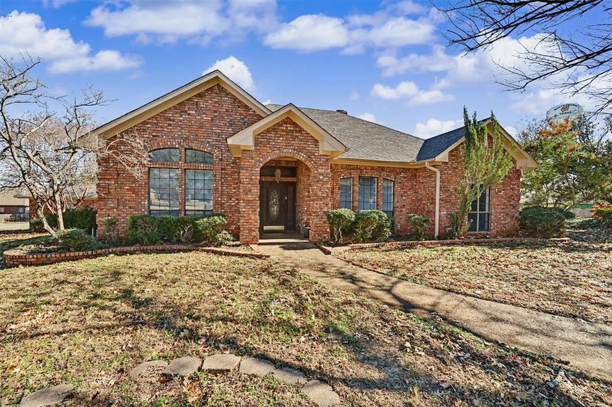 Welcome home to this well designed 4 bed, 3 bath home just a few blocks from downtown Whitesboro, perfectly situated on a .35 lot. This home is filled with character and thoughtful design, featuring a primary suite with a generous sitting area and plantation style shutters in many rooms. The kitchen has beautiful granite countertops and an antique style Heartland range with a gas cooktop and additional built-in wall electric oven and microwave.  Additional highlights include a separated guest suite, a versatile bedroom or office with a stunning floor to ceiling built in bookshelves, and an abundance of storage with numerous closets throughout the home. Outside you'll find an easy to maintain yard, a charming covered patio and a custom iron fence. This home is conveniently located near Winstar World Casino, Lake Texoma and 20 miles to the new billion-dollar TI campus or Global Wafer.