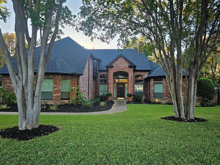 Available for immediate move-in! One of the most recent total renovation homes in Southlake is now available for lease! Fresh Landscaping just installed!
This reimagined residence blends sophistication and comfort with a resurfaced lagoon pool and pond featuring updated equipment, surrounded by a lush, treed backdrop offering serene seclusion. Inside, every detail has been refreshed in 2024, including new wide-plank flooring, designer lighting, lighted mirrors in the primary bath, newer blinds and windows, fresh paint, and premium appliances—refrigerator, washer, dryer, stove, and double oven. The chef-inspired kitchen features a large peninsula with seating for six, ideal for entertaining or casual dining. Epoxy-coated garage floors (2025) add a sleek finish, while lawn and pool maintenance are included for effortless living. Enjoy access to community amenities including tennis courts, walking trails, pool, and playground—all just moments from the best of Southlake’s dining and shopping. Dogs considered; short-term lease options available.