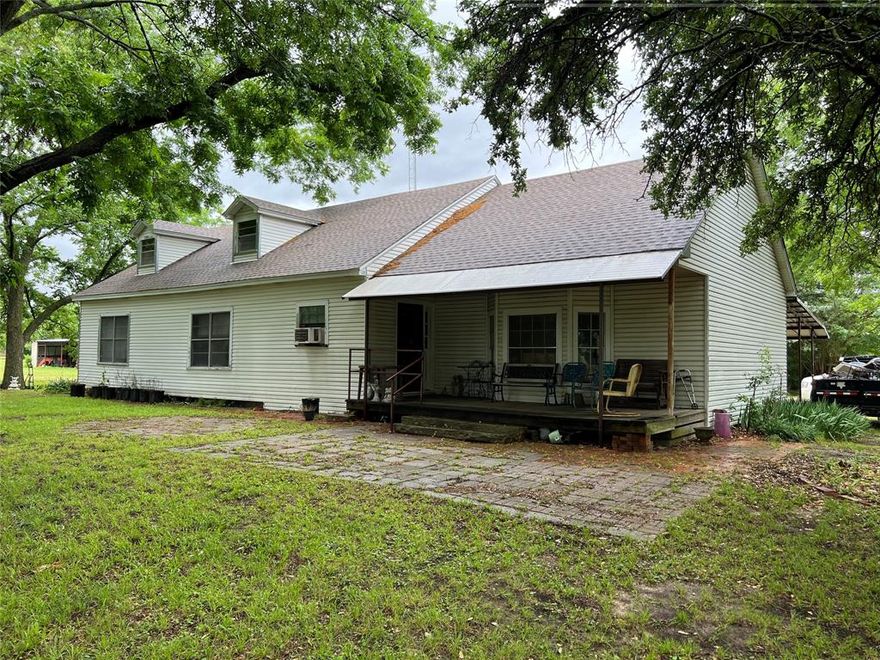 Large older farm home on 5.81 acres in Era ISD. Land has 838' frontage on FM 922 - could be divided or developed. Includes 30X60 metal shop with 20' enclosed shed and 20' open shed for total area of 4,200 SF.  House is on a well but there is Era water along FM 922.  House will need lots of TLC - a majority of the value is in the land and shop.