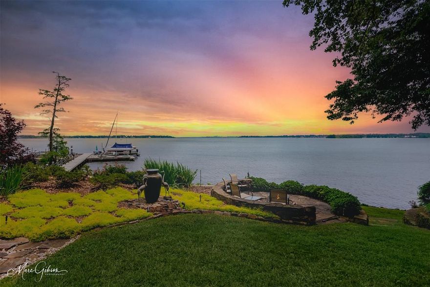 One-of-a-kind architect-designed waterfront estate on a stunning 1.38-acre peninsula lot with some of the longest unobstructed views on Cross Lake. Private gated cut-de-sac with just two homes, protected by Covenants, wooded buffer for added privacy. Custom-built single-owner home with 3,380 heated sq ft and extraordinary craftsmanship including antique reclaimed wood from a historic Shreveport warehouse, solid-core doors, Adirondack Naturals doors, insulated, metal-clad wood windows by Vetter and 10 ft ceilings with a soaring 17 ft 4 in vaulted Great Room. East-facing orientation provides breathtaking sunrises and moonrises, natural shade in the afternoons, cooling south and east breezes and exceptional storm protection. Outdoor living includes a two-level deck with a functional hot tub, screened porch with built-in vent hood and space for grilling, flagstone firepit with 180 degree open-water views and a 125 ft engineered pier with two 3,000 lb boat lifts, jet ski lift, docking for a 24 ft party barge, water access, underground drainage and utilities in place for a future boathouse. The chef’s kitchen features black granite countertops, all pull-out cabinetry, multiple appliance garages, Sub-Zero and Dacor appliances including convection oven, 50 lb ice maker, excellent pull-out vent hood, trash compactor, walk-in pantry and lake views. The primary suite includes a two-person shower, walk-through closet to laundry and built-in ironing board.  The home includes a post-tension slab, heavy-duty Z-wall retaining system with French drains, future elevator shaft, oversized garage with storage rooms, whole-home generator, bug misting system, thick exterior walls for high efficiency, underground drainage to the pier and lake-fed irrigation. A rare opportunity to own a master-crafted estate with unmatched privacy, water frontage and panoramic lake views. Please see the list of features and more information attached.