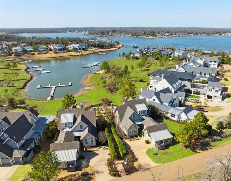 OFFERED FULLY FURNISHED WITH GOLF CART & ACCESSORIES

Perfectly positioned along one of Long Cove’s original coves, Dodds Landing 24 is a stunning lakefront retreat that captures the essence of refined lakeside living. Built in 2018 and offered fully furnished, this exceptional residence combines timeless Low Country architecture with sophisticated modern design—creating a sanctuary where every detail reflects comfort, craftsmanship, and effortless elegance.

Expansive windows frame sweeping sunset views across the lake, filling the home with natural light and a serene sense of connection to the water. The open-concept living spaces are ideal for entertaining, featuring a chef’s kitchen with a grand island, a vaulted living room with a stone fireplace, and a spacious porch perfect for evening gatherings under the Texas sky.

Set within the exclusive Long Cove community on Cedar Creek Lake, this home offers access to an unparalleled lifestyle. Residents enjoy miles of hiking and biking trails, championship golf, tennis and pickleball courts, resort-style pools, a lake club, and a vibrant social scene anchored by the community’s bar and grill venues.

Dodds Landing 24 is more than a home—it’s a destination for those who value luxury, leisure, and the beauty of lakeside living in one of Texas’ most coveted private communities.

For a private tour or more information about Long Cove’s amenities, visit the Long Cove website or contact the Long Cove team.