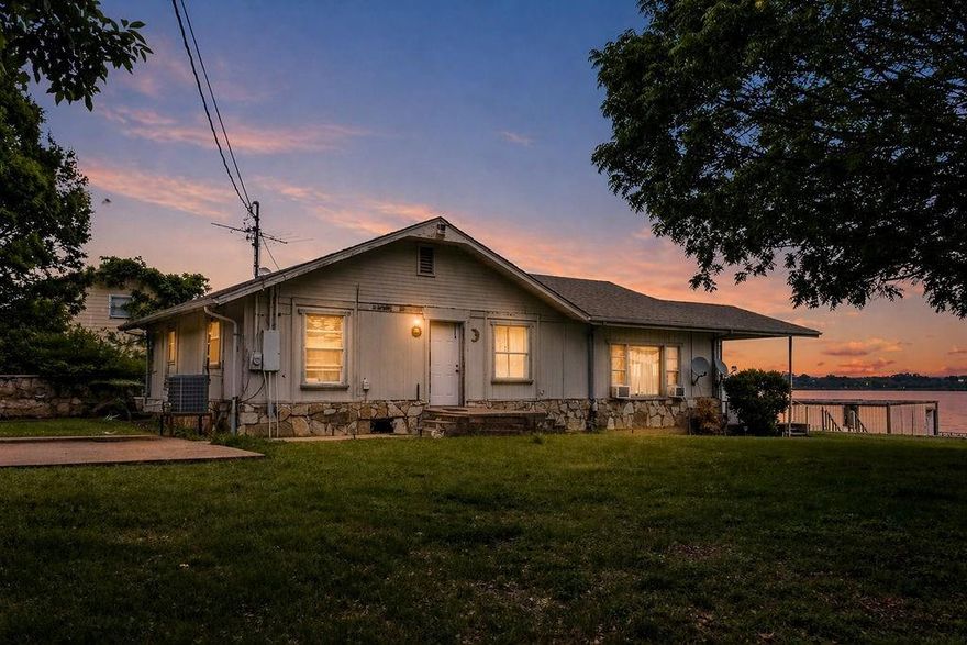Wake up to water views every morning in this lakefront property nestled inside the sought after Arrowhead Shores community. Set on a generous lot with direct lake access, a boat dock structure and an unfinished exterior building already in place, this is a rare opportunity for someone with vision ready to put in the work and build serious equity in the process. Inside the open concept layout flows naturally from room to room with natural light pouring in and unobstructed water views stretching out from the great room. The property is being sold as is and is ready for the right buyer to come in and make it their own. The primary suite offers a soaking tub ensuite and plenty of space to customize. Secondary bedrooms are generously sized and flexible enough to accommodate family, guests or a short term rental setup once the work is done. Out back a private lakeside deck sits right on the water and gives you a front row seat to everything this lake has to offer whether that is morning coffee, sunset fishing or simply unwinding in a setting that is genuinely hard to replicate. Mature trees frame the lot and the direct water access makes this one worth a serious look. Priced to reflect the condition and the opportunity. Bring your contractor, bring your creativity and turn this into exactly what you want it to be. Full time residence, weekend getaway or income producing STR the bones and the location are already working in your favor