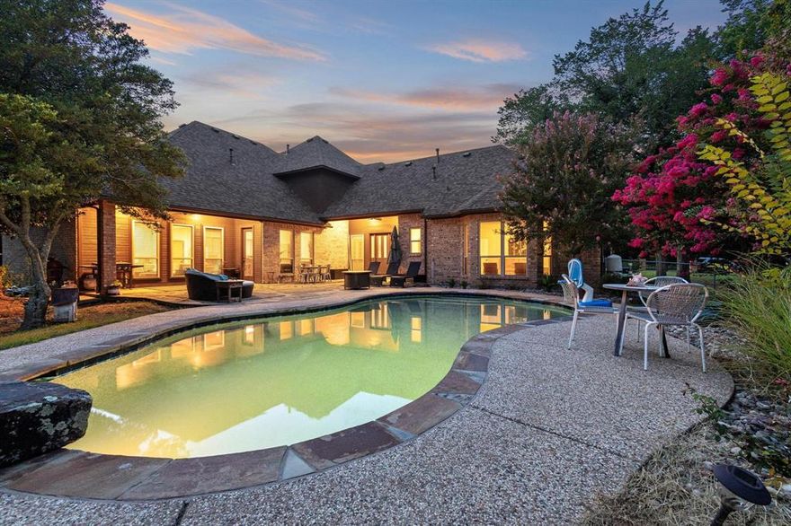 Welcome to your dream home where comfort meets charm in this stunning four-bedroom, three-bathroom residence spanning an impressive 3,896 square feet. This thoughtfully designed property offers the perfect blend of spacious living and intimate gathering spaces that will make every day feel like a celebration.

Inside, you'll find an open-concept kitchen with a spacious dining area and breakfast bar — perfect for gathering and entertaining. Two expansive living rooms, each with its own fireplace, create inviting spaces for both relaxing and hosting. High-end finishes throughout include wood flooring, crown molding, soaring ceilings, and plantation shutters.

Take the elegant bridal staircase upstairs to find additional bedrooms connected by a well-designed Jack-and-Jill bathroom. The oversized 3-car garage adds even more convenience.

The true showstopper lies beyond your back door. The spacious yard provides room for children to play, pets to roam, and adults to unwind after long days. Thoughtfully designed with a wraparound layout, nearly every living space — including the luxurious primary suite — showcases views of the private backyard oasis, complete with a custom Allison pool and natural landscape.

Location matters, and this home delivers convenience without compromise. Daily errands become effortless with grocery stores just a short drive away, keeping your pantry stocked and your schedule flexible. When weekend adventures call, Waterloo Lake offers the perfect escape for hiking, picnicking, or simply reconnecting with nature.

This property represents more than just square footage; it's where memories are made, laughter echoes through hallways, and life's best moments unfold. From intimate family dinners to grand celebrations, every space has been designed to accommodate life's precious moments. The generous room sizes ensure everyone has their own space while maintaining the warmth and connection that makes a house truly feel like home.