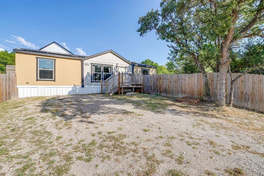 Welcome to this charming 3-bedroom, 2-bathroom double-wide home in the desirable Comanche Cove subdivision of Granbury, Texas. Offering 1,372 square feet of comfortable living space, this home provides a functional layout with plenty of room for family and guests.
Comanche Cove residents enjoy access to outstanding community amenities, including a private boat ramp, community dock, clubhouse, and refreshing pool—perfect for lake living and entertaining.
Whether you’re looking for a full-time residence or a weekend getaway near Lake Granbury, this property offers convenience, comfort, and a wonderful community lifestyle. Home does have solar panels, loan on them is assumable. Washer, dryer, and refrigerator will convey with sale of property.