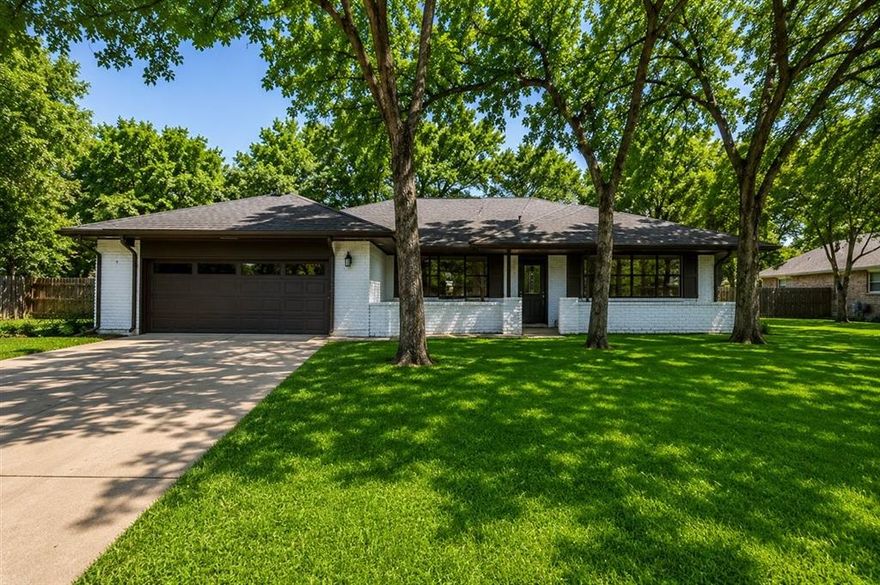 Welcome home to this beautifully renovated 3 bedroom, 2 bath home with a 2-car garage, perfectly situated on an oversized lot of more than half an acre in Indian Harbor! Surrounded by huge mature oak trees and featuring an expansive driveway, this property offers the perfect blend of comfort, space, and charm. Recent renovations include fresh exterior paint, all new flooring, updated countertops, fresh texture and paint, and new appliances, making this home truly move-in ready. Step outside to a huge fully fenced backyard with endless possibilities! Whether you envision adding a pergola, swimming pool, outdoor kitchen, or simply enjoying the peaceful setting under the shade trees, this property offers plenty of room to expand and create the ultimate outdoor entertaining space or private retreat. Enjoy peaceful lake canal views while embracing the simplicity of outdoor living and relaxation. Residents of Indian Harbor enjoy access to a 24-hour guarded entrance, community pool, and neighborhood amenities. Conveniently located just outside the city limits and only minutes from Lake Granbury, the Historic Granbury Square, shopping, dining, and entertainment, this property offers the ideal balance of privacy, convenience, and lifestyle.