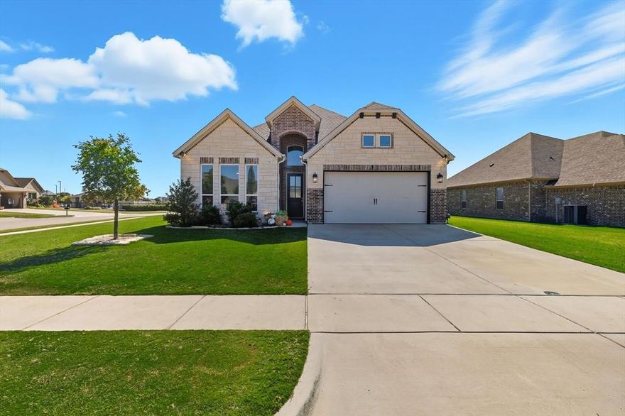 Located on a desirable corner lot in gated Hideaway at Harbor Lakes, this beautifully maintained home combines custom finishes with an unbeatable location. From the moment you step inside, you’ll be welcomed by barrel ceilings with stained wood accents and brushed nickel lighting that create an inviting, upscale feel. The open-concept layout features designer wood-look tile flooring, a glossy subway tile backsplash, and upgraded granite countertops that make the kitchen as stylish as it is functional. Double ovens and a spacious walk-in pantry make entertaining effortless, whether you’re hosting friends or cooking for family. The primary suite offers a serene retreat with stained ceiling beams and a large closet that conveniently connects to the laundry room, a thoughtful design you’ll appreciate every day. Outside, enjoy a fully fenced back yard, the neighborhood’s brand-new pickleball courts and nearby clubhouse, perfect for relaxing, socializing, and staying active. This home delivers the full Harbor Lakes lifestyle. Elegant, easy, and perfectly located.