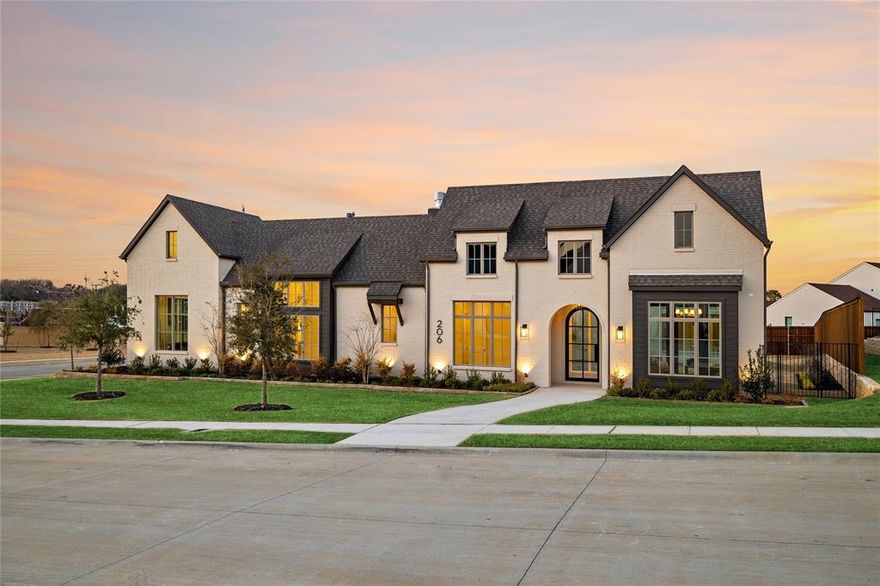This newly completed single-story showplace masterfully blends rustic charm with sleek sophistication, offering a rare fusion of French countryside elegance and modern Texas luxury. Nestled on a generous .485-acre corner lot, this custom-built home spans 4,232 square feet and features 4 bedrooms, 5 bathrooms, and a thoughtful layout tailored for elevated everyday living.
Step inside to soaring cathedral ceilings, sun-drenched living spaces, and rich textures throughout. At the heart of the home lies a designer kitchen outfitted with an oversized island, premium appliances, and an impressive butler’s pantry—perfect for entertaining with ease. The private home office and spacious game room offer flexibility for both work and play.
Each of the four bedrooms includes its own ensuite bath and walk-in closet, ensuring comfort and privacy for family and guests. The primary suite is a true retreat, featuring vaulted ceilings, a spa-inspired bath, and a dream-worthy walk-in closet. Step outside to an expansive covered patio with a fireplace and outdoor kitchen, creating the perfect setting for year-round gatherings.

Located in the heart of prestigious Colleyville and award-winning GCISD, this home by Graham Hart Home Builder offers a rare combination of style, space, and sophistication—all on a beautifully landscaped corner lot.