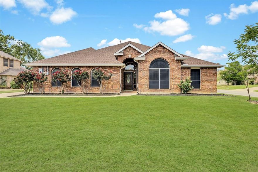 Tucked on an oversized corner lot backing to a serene green space in Denton's Ridgemont, this inviting single story home with a 3-car garage and pool is the perfect place to gather, relax, and make memories. From the moment you enter, you're greeted by a light-filled, open-concept layout that effortlessly connects the spacious living room, formal dining area, kitchen, and breakfast nook, ideal for both everyday living and entertaining. The inviting living room features a cozy gas fireplace and a wall of windows that flood the space with natural light. Designed for both everyday cooking and hosting, the gourmet kitchen showcases a center island, upgraded granite countertops, a stylish backsplash, stainless steel farm sink, double ovens, and abundant storage and prep space. Enjoy casual meals in the breakfast room or host elegant dinner parties in the formal dining space. At the end of the day, retreat to the secluded primary suite with direct access to the pool and a luxurious ensuite bath featuring dual sinks, jetted soaking tub, updated seamless glass shower, and a spacious walk-in closet. Three additional bedrooms share a beautifully appointed full bath with a linen closet, providing comfort and flexibility for family, guests, or a home office setup. Step outside to your personal backyard oasis, complete with a sparkling heated pool and spa, covered patio perfect for relaxing or entertaining, and a convenient storage shed. Plus, enjoy the long-term benefits of the paid off solar panels that help keep utility bills low year-round. This home offers the perfect blend of comfort, style, and sustainability, all in a prime location with easy access to 35E.