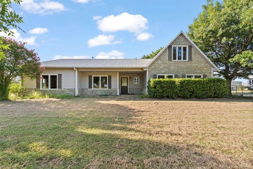 Experience the perfect blend of peace, space, and opportunity just minutes from I-35! Built in 2005 with durable steel beam construction, this spacious ranch-style home is built to last and designed to impress. Expansive windows fill the home with natural light, offering serene views of the surrounding acreage.
11.77 unrestricted acres, this property offers endless potential!! Whether you’re looking to raise animals, grow a business, or simply enjoy wide-open space away from the city noise. With 4 bedrooms, 2.5 baths, two living areas, a flex room, and an upstairs bonus room ideal for a game room, office, or craft studio, this layout adapts to your lifestyle with ease.
You'll also find THREE versatile outbuildings, including a climate-controlled facility previously used for meat processing and smoking—complete with its own water well—ready to be repurposed as a business, workshop, or storage.
Additional highlights include:
Three-bay detached garage
Three-way fenced acreage—ideal for livestock or pets
Private road access for added seclusion and security
Whether you're dreaming of homesteading, hosting, or relaxing in total privacy, this unique property delivers. All within easy reach of DFW amenities, schools, and shopping.
Come discover everything this one-of-a-kind Texas retreat has to offer.