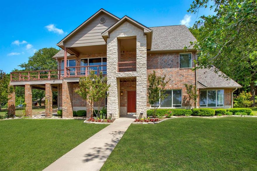 Experience elevated lake living at 154 Vista Court in Pottsboro, Texas, where breathtaking views of Lake Texoma take center stage. From the moment you arrive, the expansive wrap-around decks invite you to slow down, soak in the scenery, and enjoy unforgettable sunsets over the water.

Situated on a peaceful half-acre lot shaded by mature trees, this home is tucked inside a quiet, gated community—offering both privacy and a true retreat-like atmosphere. Thoughtfully designed to maximize the views, every level of the home captures the beauty of the lake and surrounding landscape.

Upstairs, you’ll find an airy, open-concept living space with soaring vaulted ceilings and abundant natural light. The spacious living room, anchored by a cozy fireplace, flows seamlessly into the kitchen and dining area—perfect for entertaining or simply enjoying everyday moments with a stunning backdrop. The oversized primary suite is a true sanctuary, featuring a private ensuite bath and generous closet space.

Downstairs, the home continues to impress with two oversized bedrooms, large closets, a second living area, and 1.5 baths—ideal for hosting guests or creating a separate space for family and friends. With lake views from both levels, this layout offers flexibility and comfort for full-time living or weekend escapes.

Whether you’re entertaining on the decks, relaxing by the fire, or taking in the tranquil surroundings, this property delivers the ultimate Lake Texoma lifestyle.