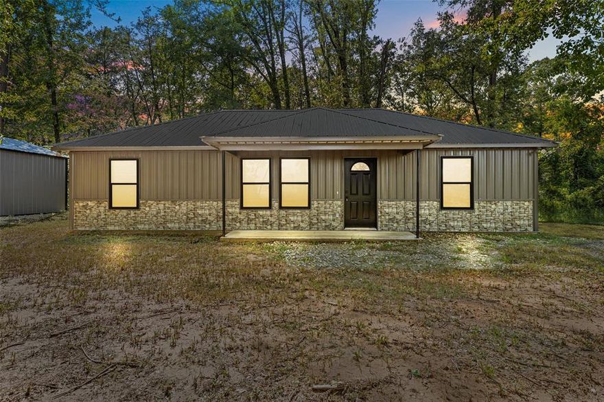 Welcome to this beautiful 3 bed, 2 bath, home offering modern comfort with a touch of country charm. Built just one year ago and never lived in, this home feels brand new and features 1,080 sq. ft. of thoughtfully designed living space. The open-concept layout with abundant natural light and vaulted ceiling gives you lots of space.  The kitchen comes equipped with a refrigerator, space savor microwave, electric range and a dishwasher.  The full size bathrooms give you plenty of room and the primary bedroom has it's own large walk-in closet.  Outside the designer metal siding gives you durability with a stylish look and the abundance of trees offer lots of shade during those hot summer months.  Set on a generous .58-acre lot, you will have plenty of space to build a workshop or just to sit back and enjoy the peace and quiet. This home is the perfect blend of modern construction and rustic charm giving you the best of both worlds, a country feel with quick access to city amenities.  Don’t miss this one—schedule your private showing today!