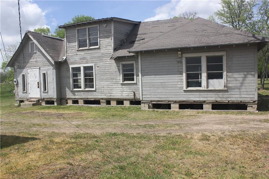 Endless Possibilities Await! This unique property is a blank slate ready for your vision! Situated on a spacious lot in a prime location, this home has been gutted with some remodeling started, providing the perfect opportunity to customize it to your style.  Upstairs, you'll find two bedrooms with brand-new carpet, for a fresh start. The bathroom is functional and has already undergone some updates. With a blank canvas awaiting your finishing touches, this home is brimming with potential! The large lot provides ample space to build a second home, workshop, or dream outdoor retreat. Plus, some building materials are included, helping to jump-start your renovation. Don't miss this incredible opportunity to create the home you've always wanted or invest in a fantastic development project. Come see the potential today!
