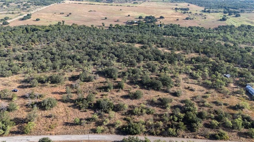 Only a few miles off of Hwy 279, this 11.001 acre piece of northwest Brown county is ready for your Farm and Home ideas! This property sits just north of Lake Brownwood between Cross Plains and Brownwood, with easy access to either. Water access through Brooke Smith SUD and there is access to power!  Beautiful mature Post oaks are scattered throughout the property as well as a mix of mesquite and cedar trees that help provide privacy and seclusion.  Great well kept area in the country! Gently rolling terrain, Multiple options for home sites, put your house up front with a deer feeder and barn towards the back. Very quiet and peacful location. This property could be your perfect weekend getaway or the place you finally build your dream home. No restrictions. Located approximately 10 minutes to beautiful Lake Brownwood, 20 minutes to Brownwood, 20 Minutes to Cross Plains, 1 hour to Abilene, and just over 2 hours to Fort Worth.  Come check it out today!